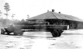 Log loaded truck at railroad depot - Zephyrhills, Florida